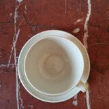 Four large cups and their tea service cups