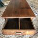 Antique Louis Philippe style farm table in solid cherry wood with turned base.