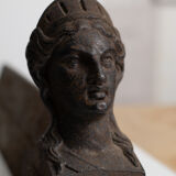 Pair of ancient cast iron chenets adorned with bust of Marianne