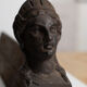 Pair of ancient cast iron chenets adorned with bust of Marianne