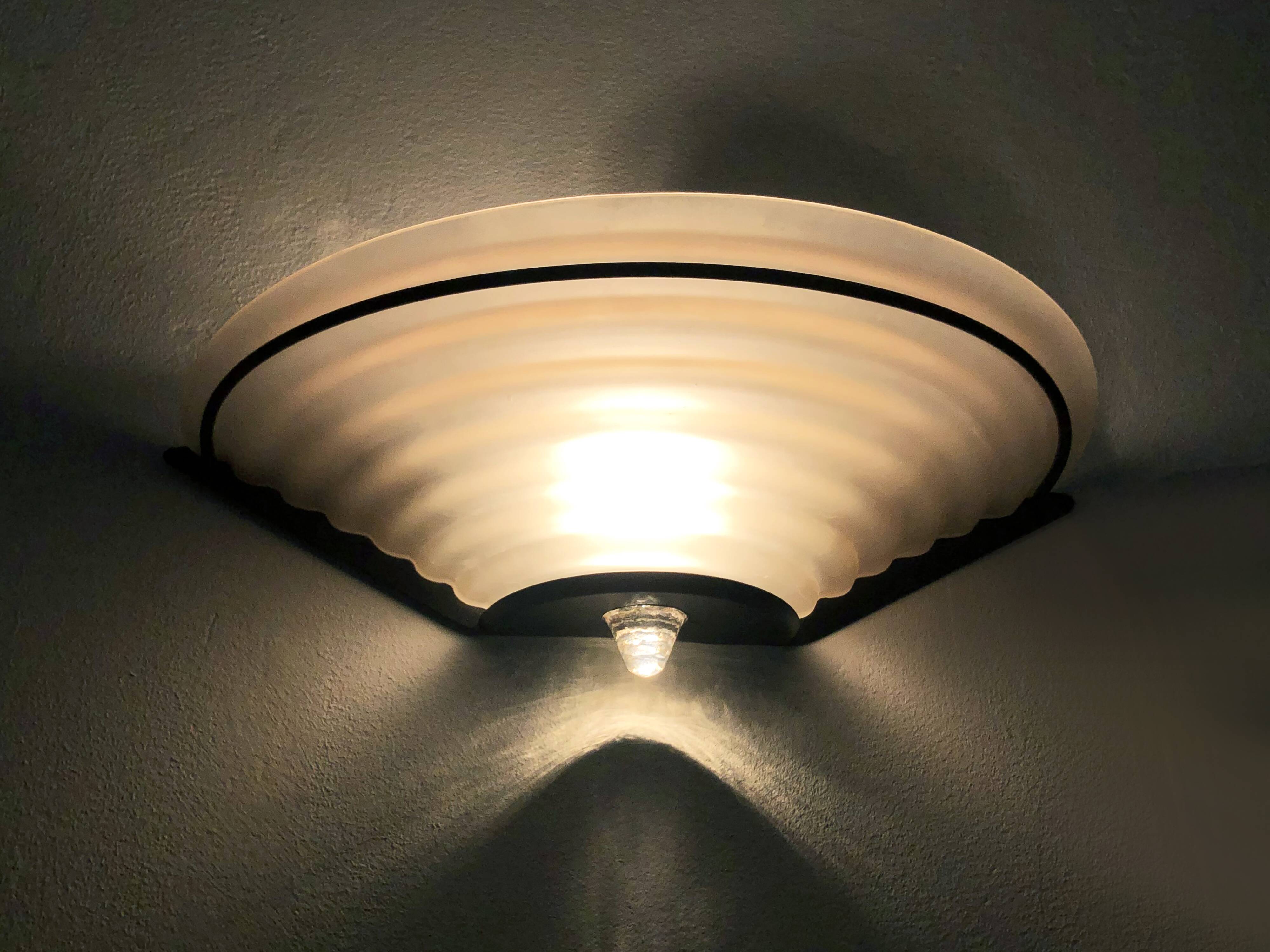 Pair of vintage italian design wall lights in metal and pink frosted glass. year 80