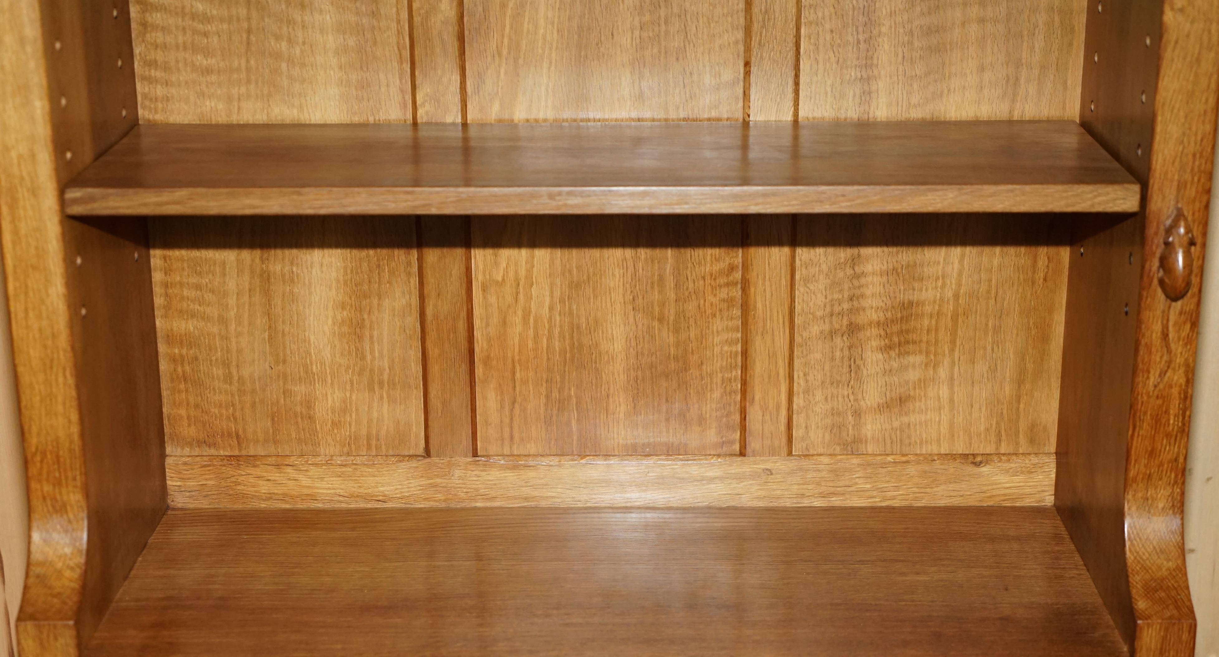 Pair of Robert Mouseman Thompson oak carved bookshelves.