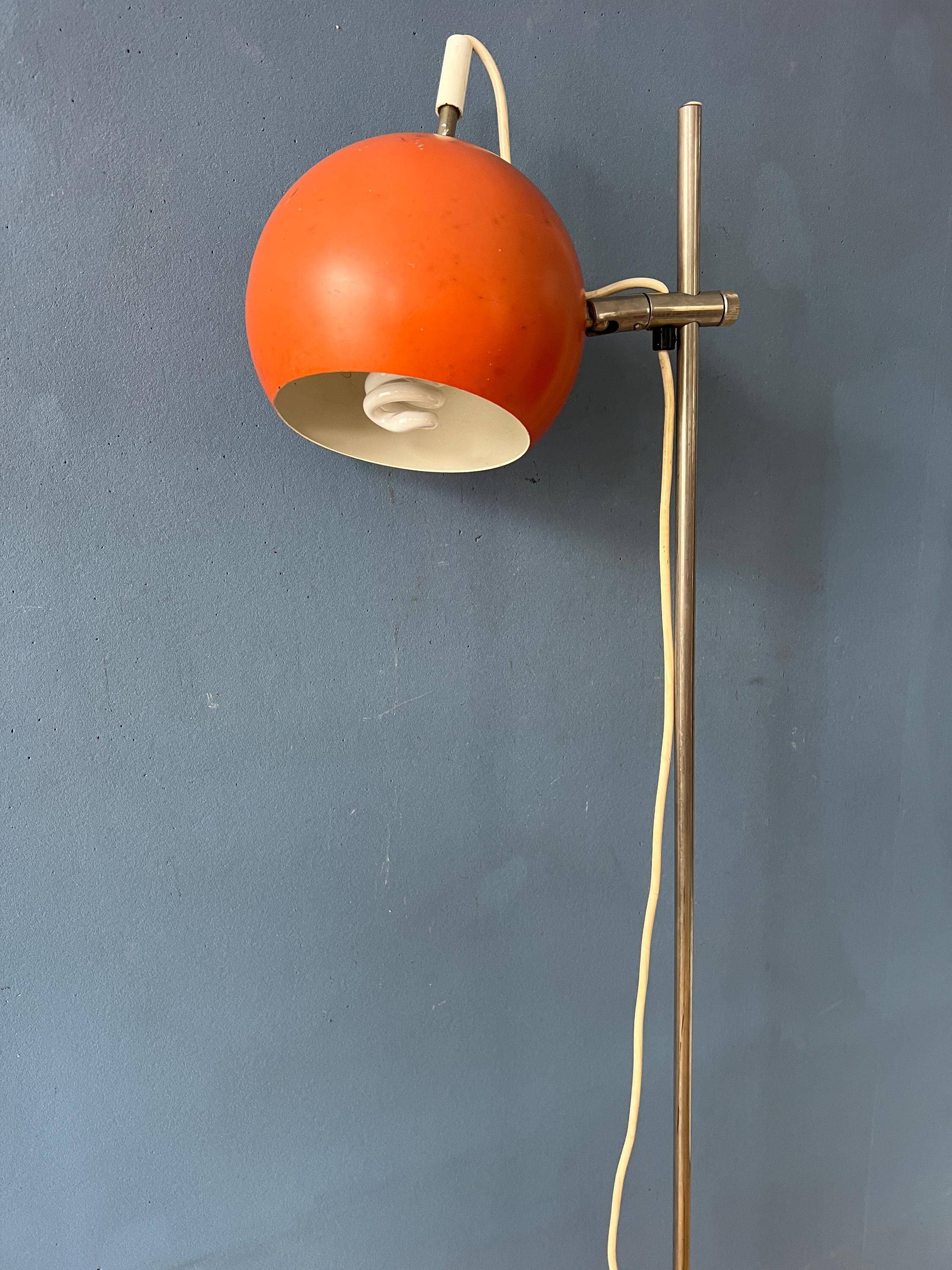 Mid-Century orange floor lamp with "eyeball" shade