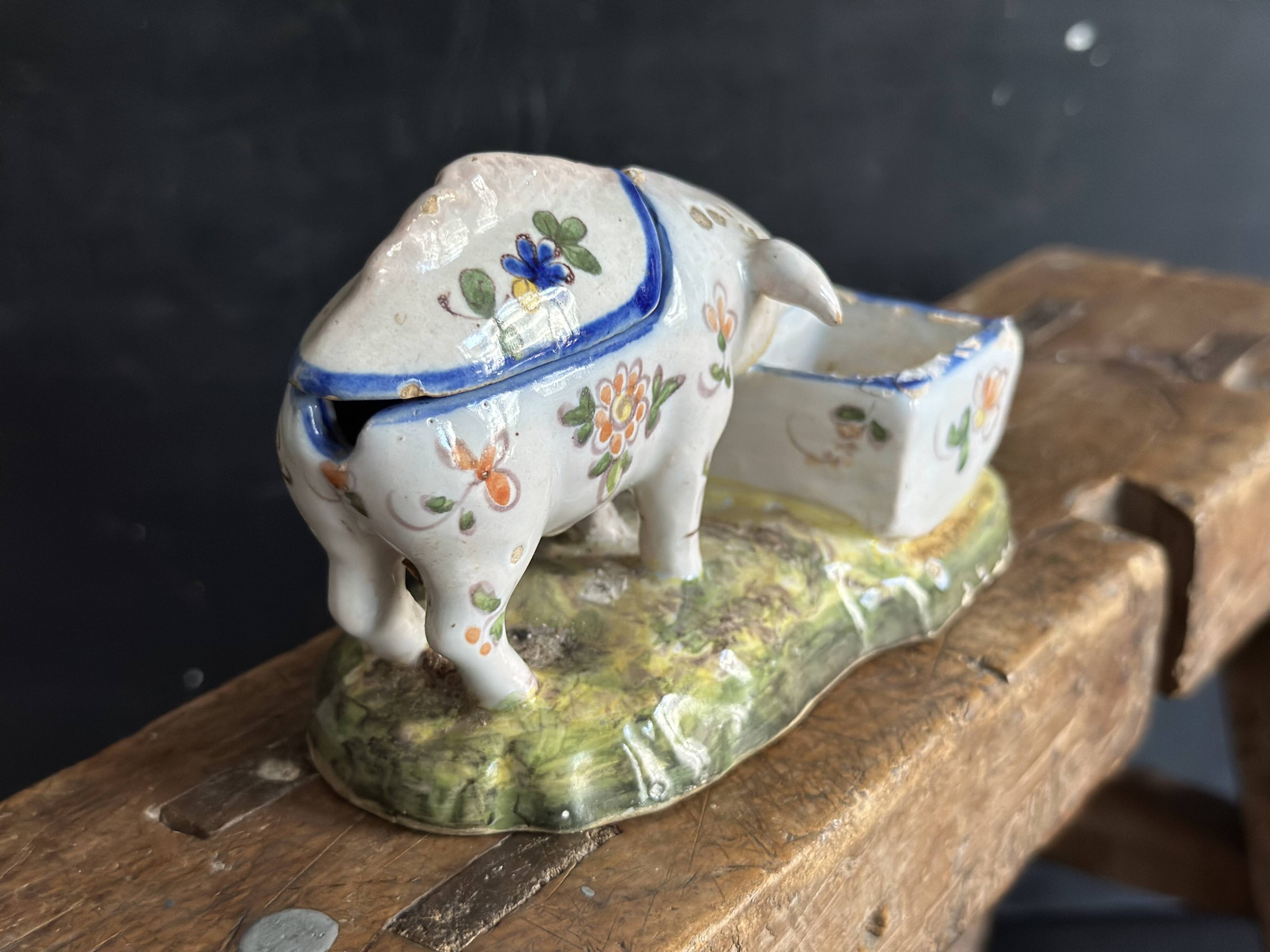 Antique earthenware pig box, salt cellar or mustard pot, floral decoration.