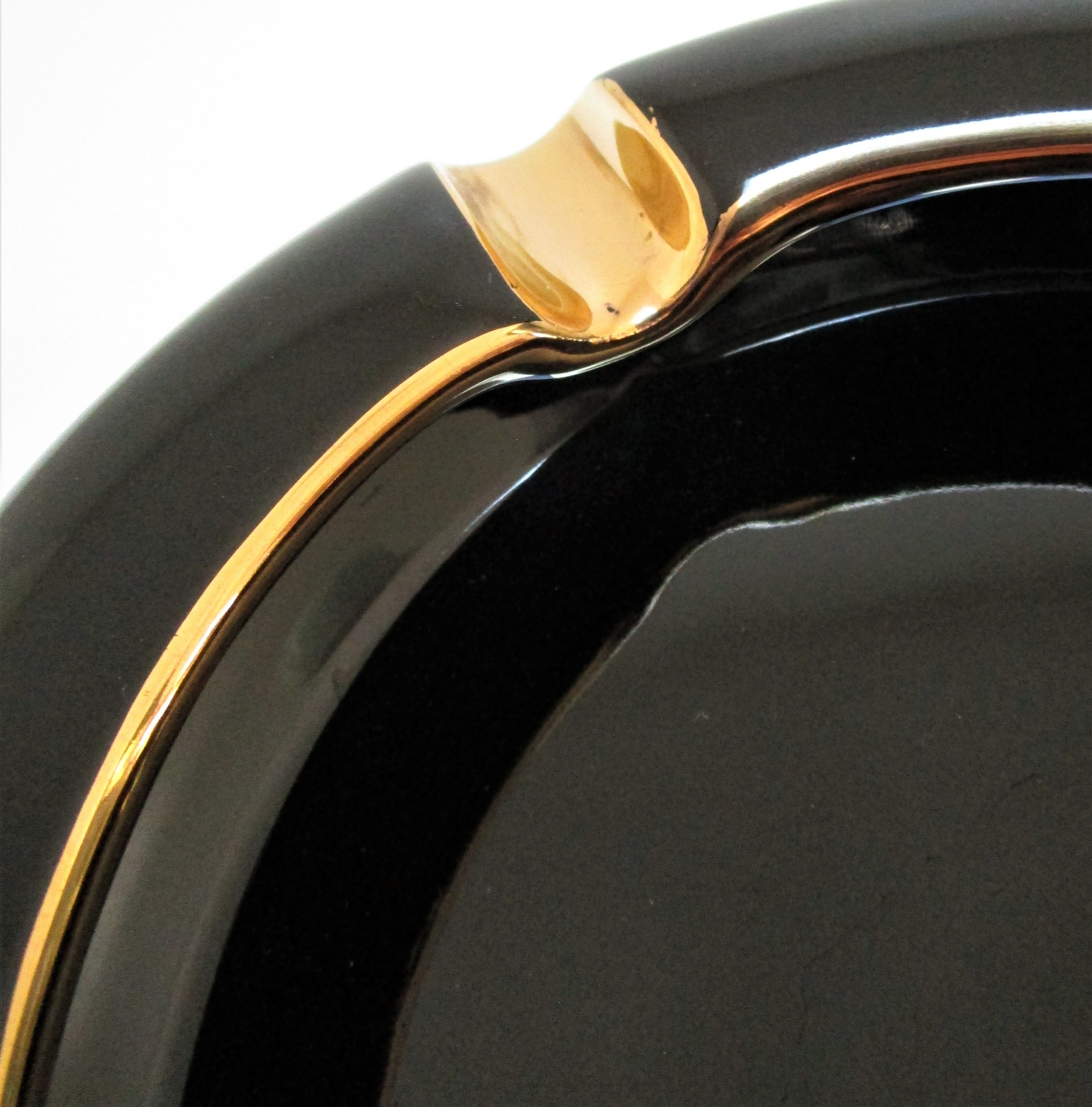 Black ceramic ashtray and vintage gold 50/60