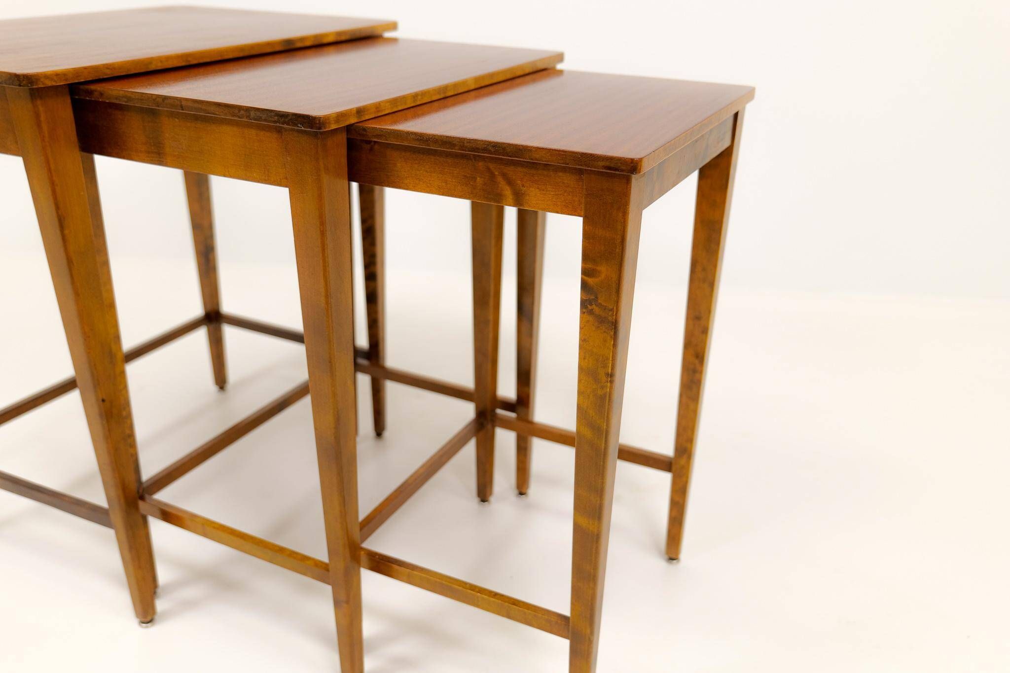 Nested tables in Art Deco style made of mahogany and stained birch, NK Sweden, 1940s.