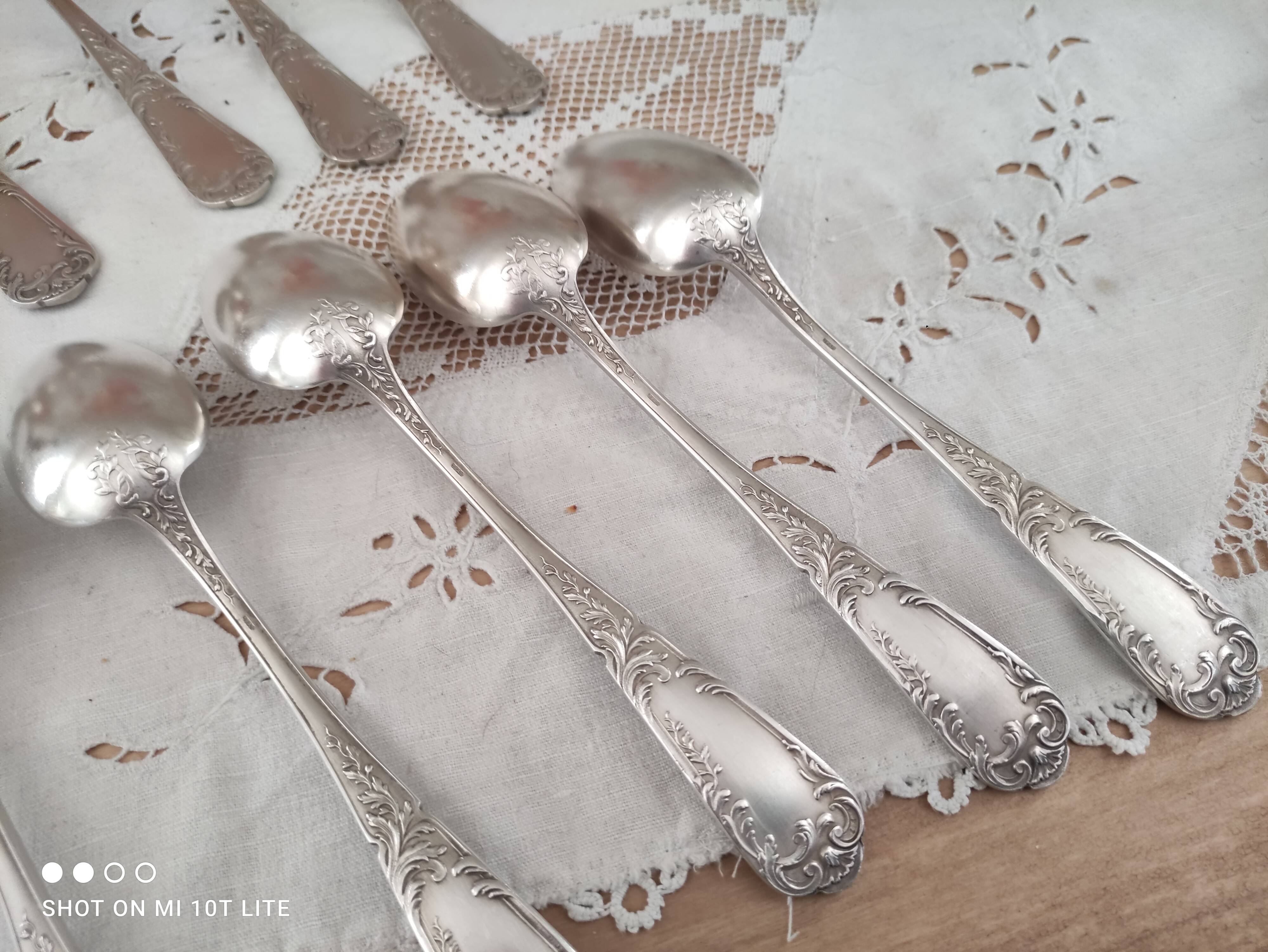 Set of 12 old silver-plated soup spoons