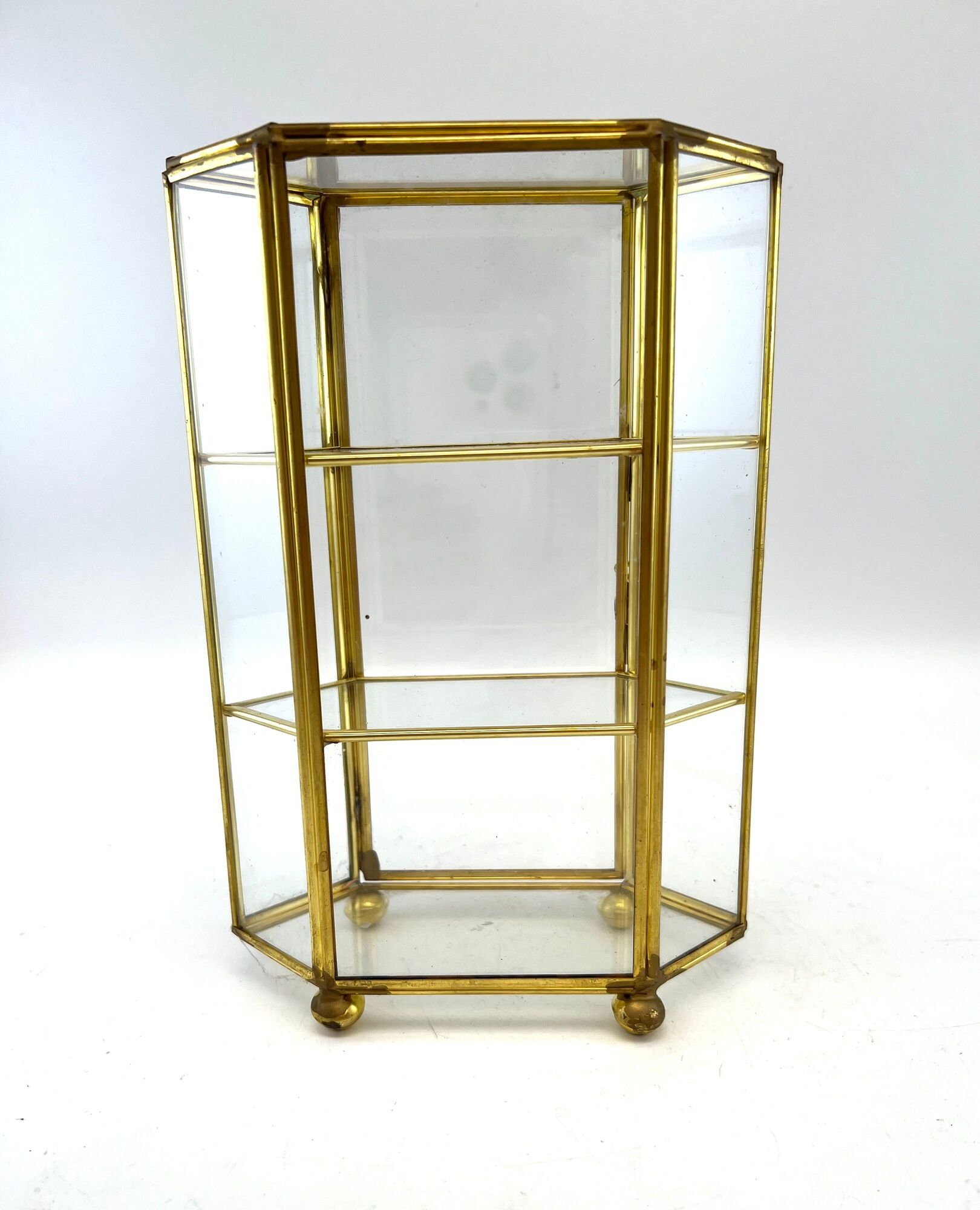 Glass and brass jewelry showcase