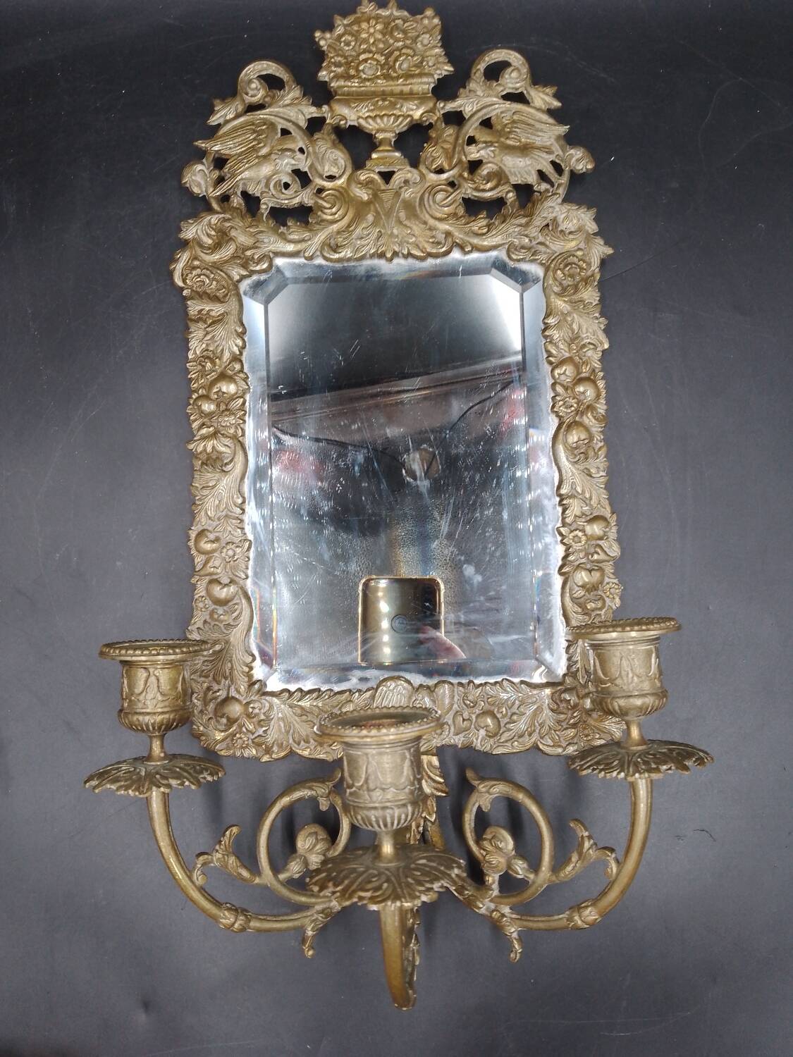 Repousse brass wall mirror with three candles, beveled glass, end of 19th century, double eagles