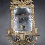 Repousse brass wall mirror with three candles, beveled glass, end of 19th century, double eagles