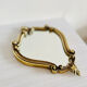 Small antique mirror in baroque style – gold frame in bronze or brass.