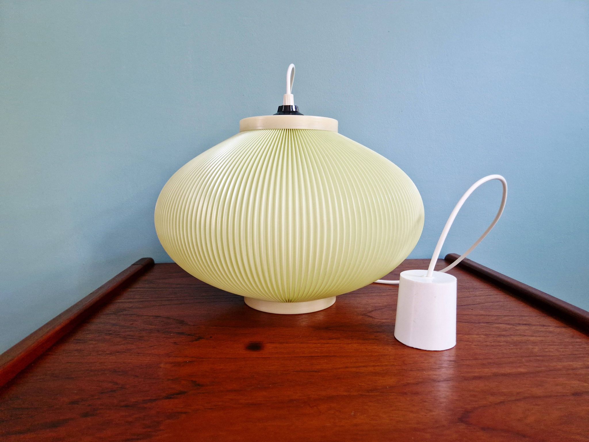 Vintage oval-shaped suspension in pleated celluloid, light green colour, 1960.