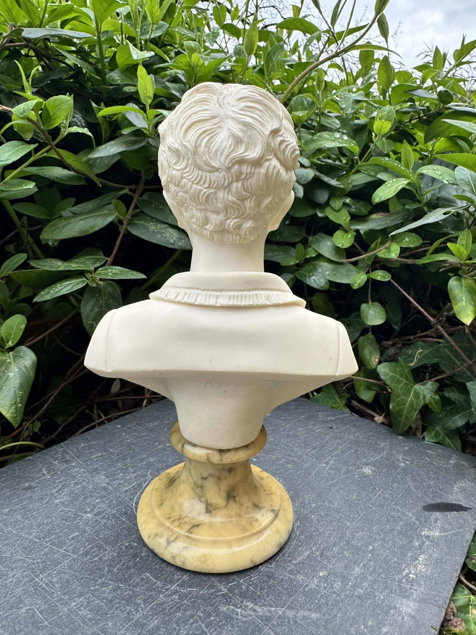 Alabaster bust of a woman signed Arnaldo Giannelli.