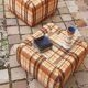 Pair of vintage 70s fabric coffee tables with glass tops