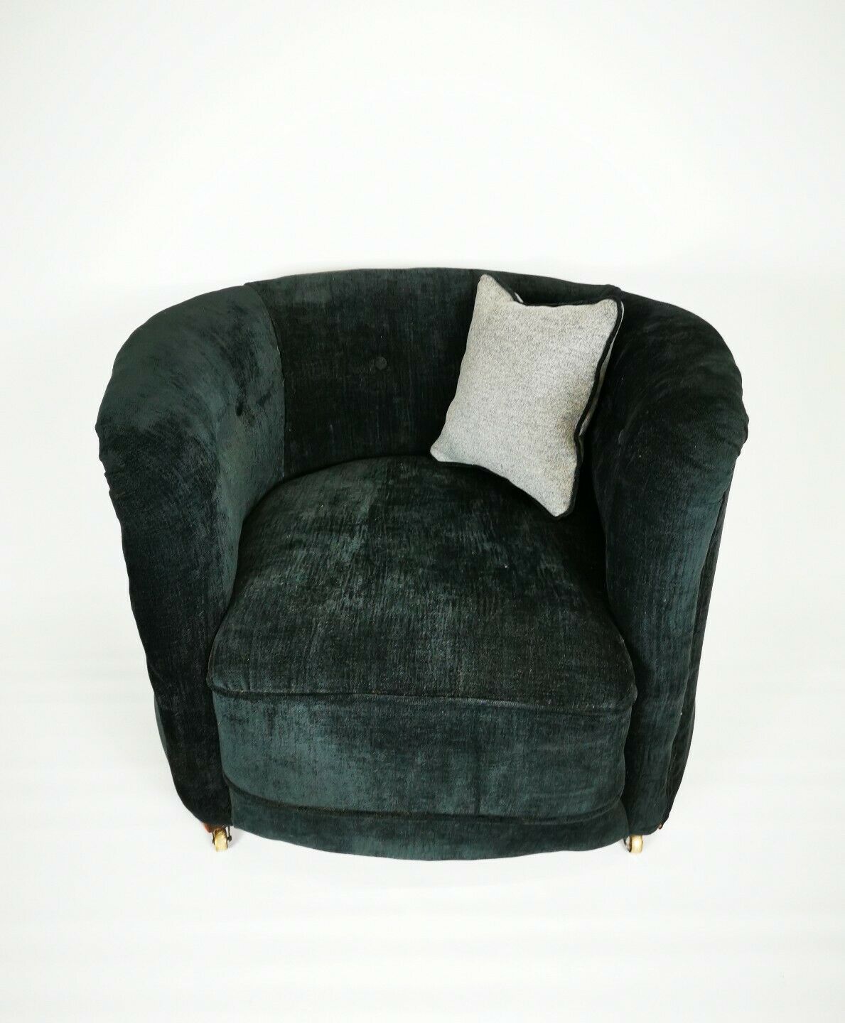 19th century black upholstered victorian tub chair on brass casters