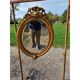 Miroir ovale en bois et stuc doré 19ème