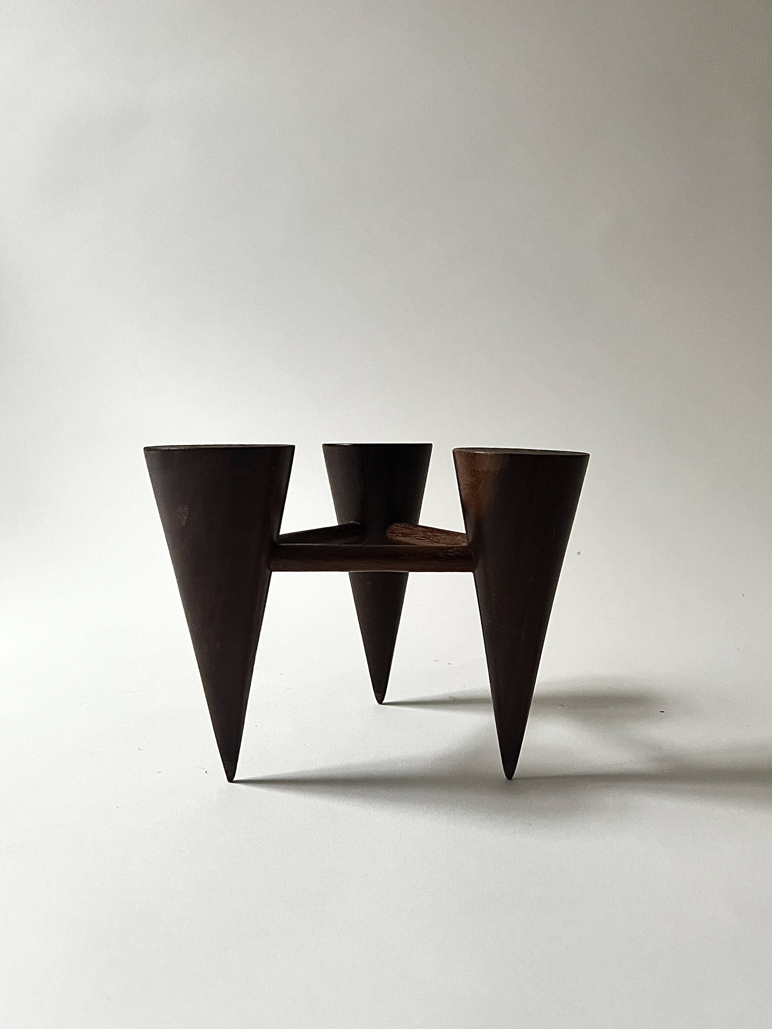 Scandinavian tripod candle holder in carved wood, design from around 1970.