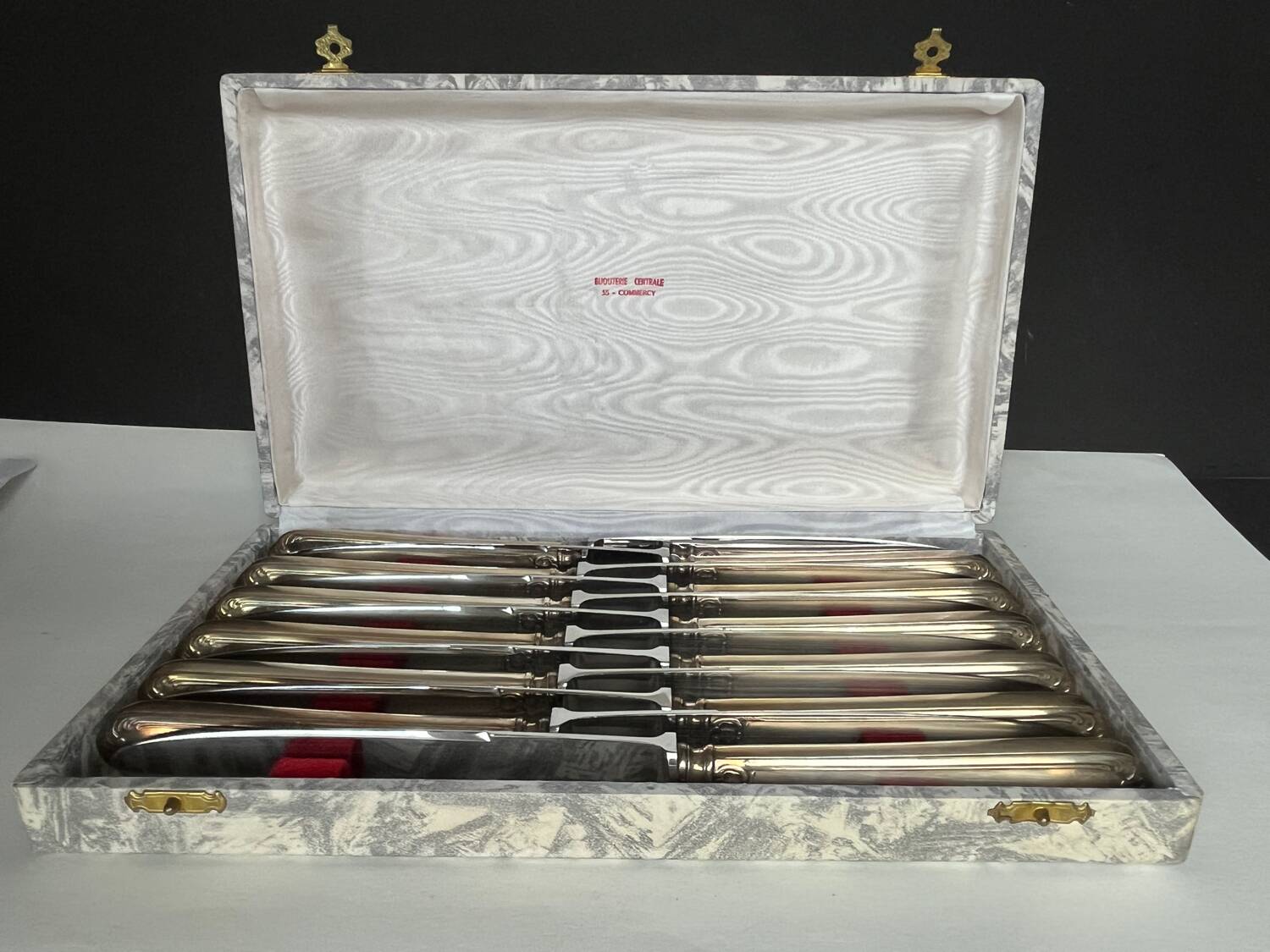 12 silver metal knives