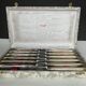 12 silver metal knives