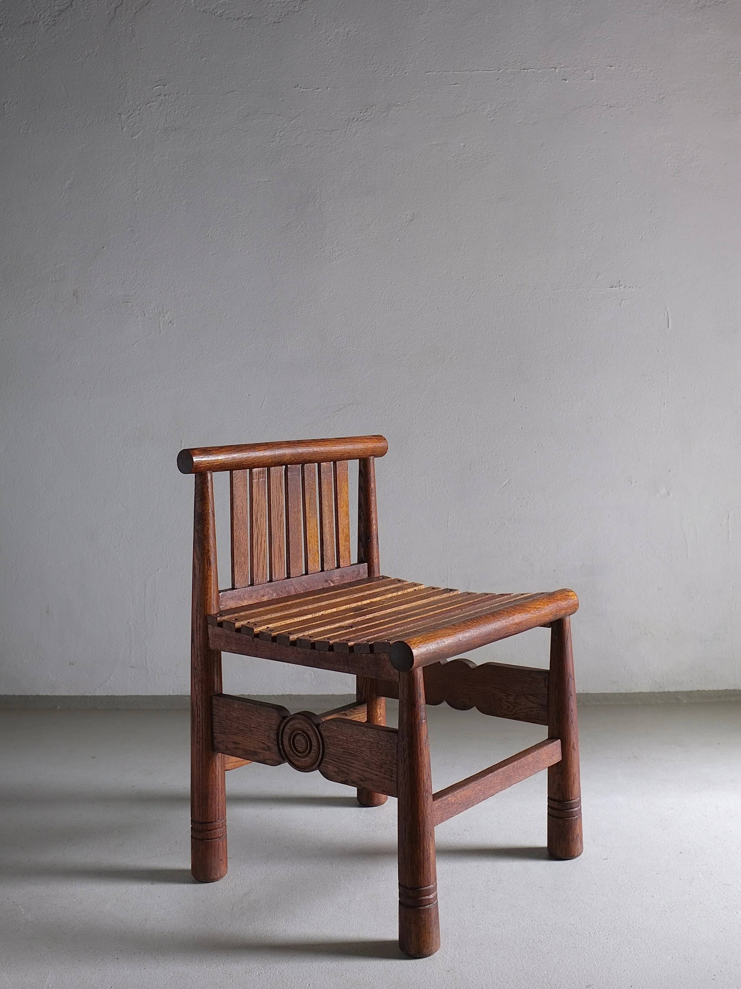 Carved oak low back chair | France | 1960s