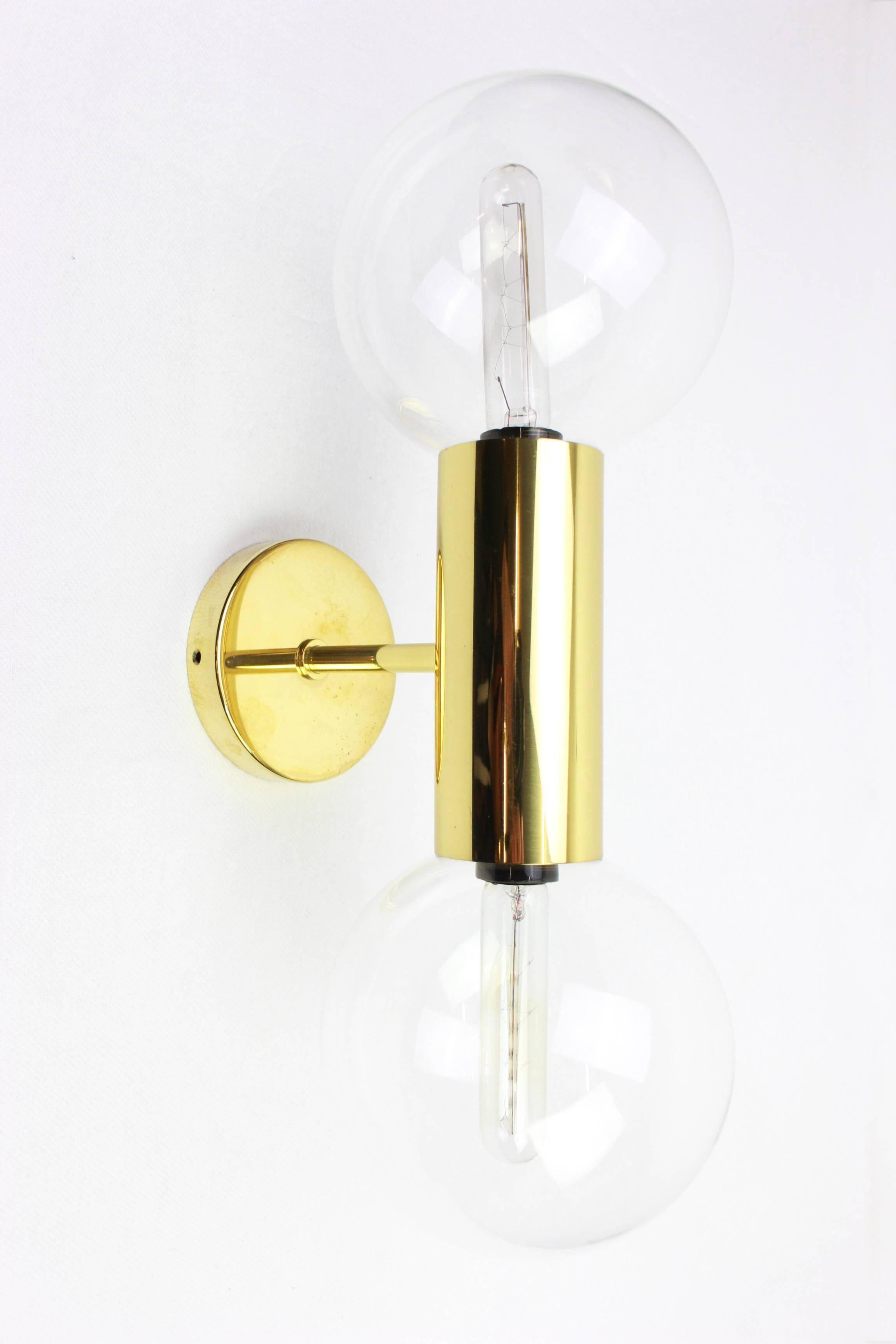 Pair of mid-century design wall lamps by Motoko Ishii for Staff, Germany, 1970s.