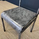 Pair of gray metal industrial chairs