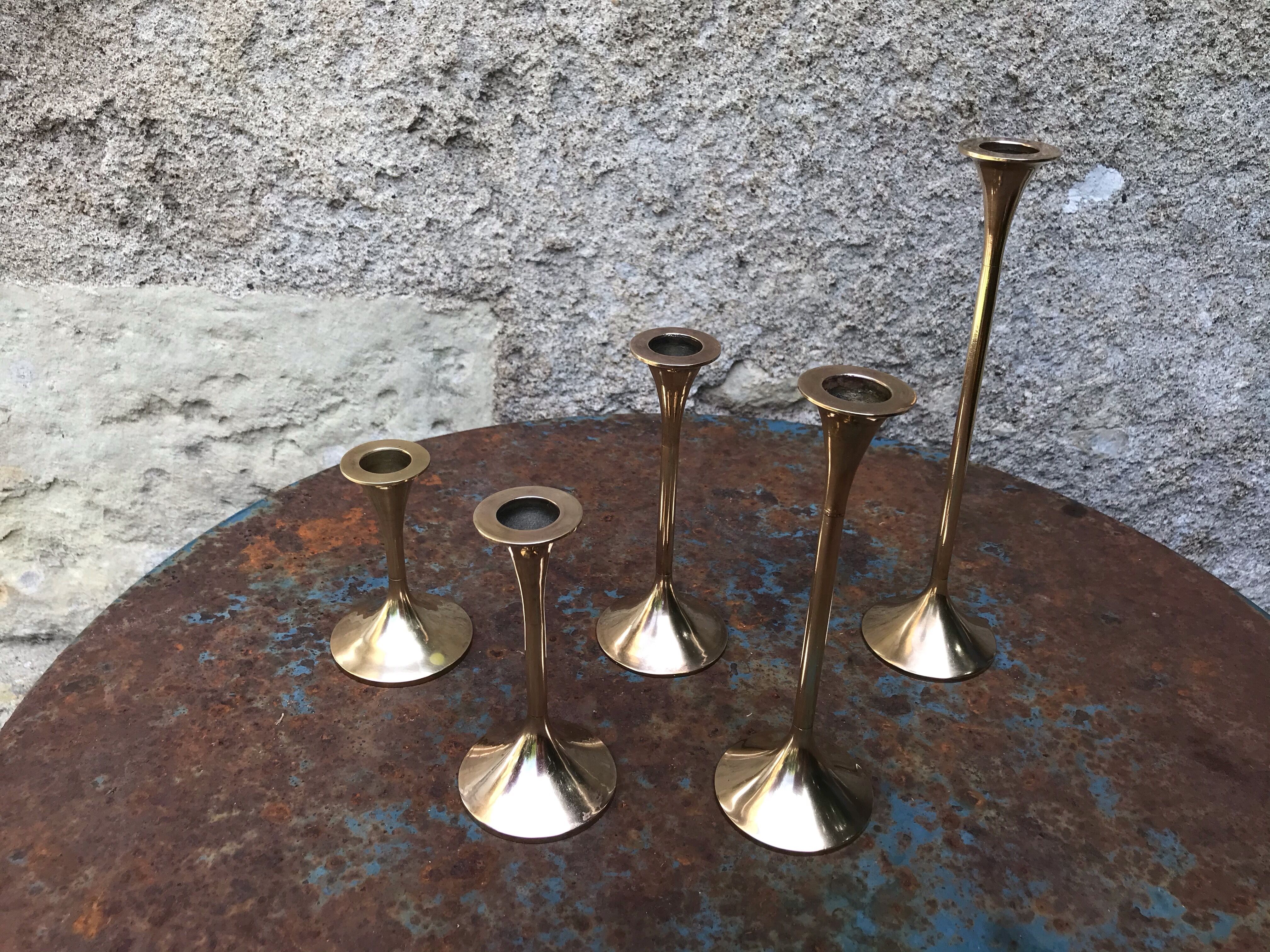 Series of 5 brass candlesticks