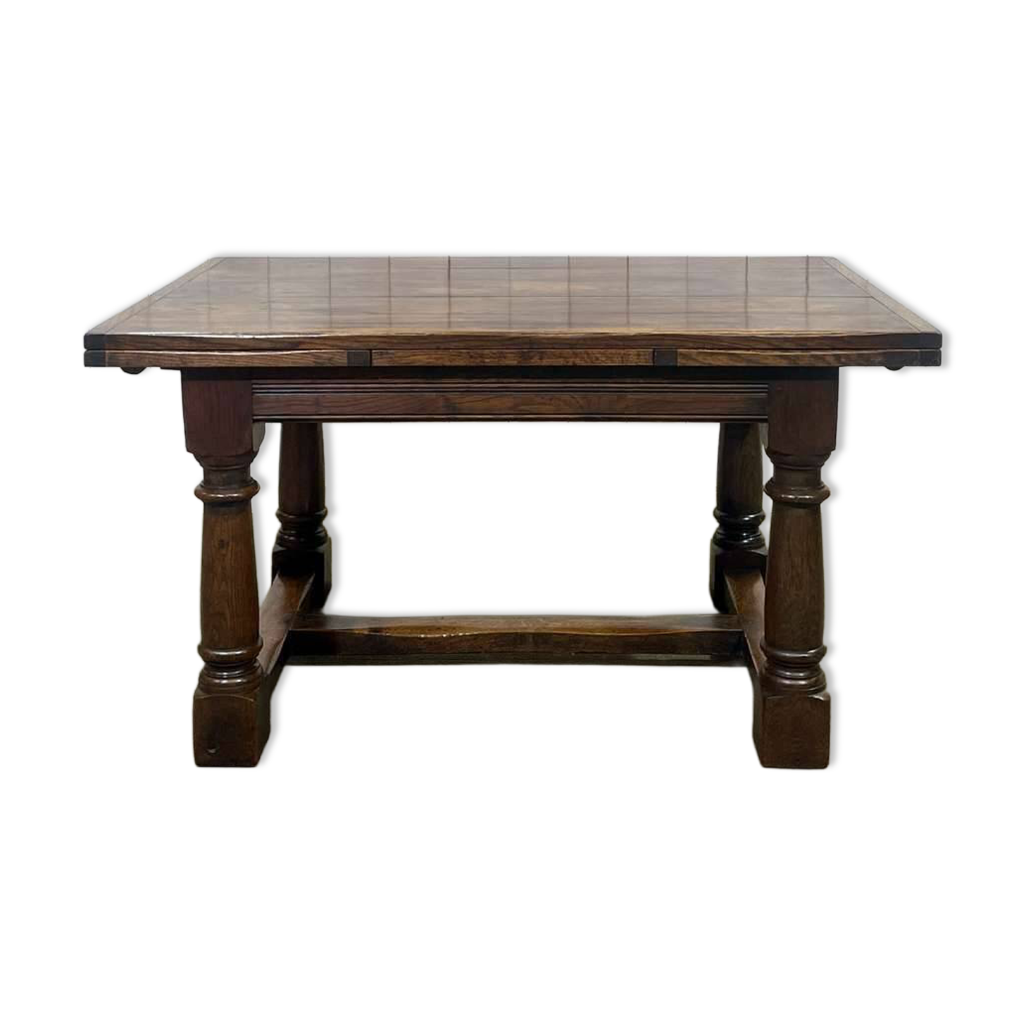 English monastery table with extensions from the late 19th century in elm and oak.