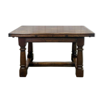 English monastery table with extensions from the late 19th century in elm and oak.