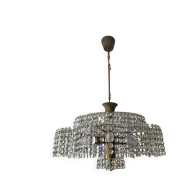 Vintage lucite chandelier with a cascade of crystal pendants from the 1970s.