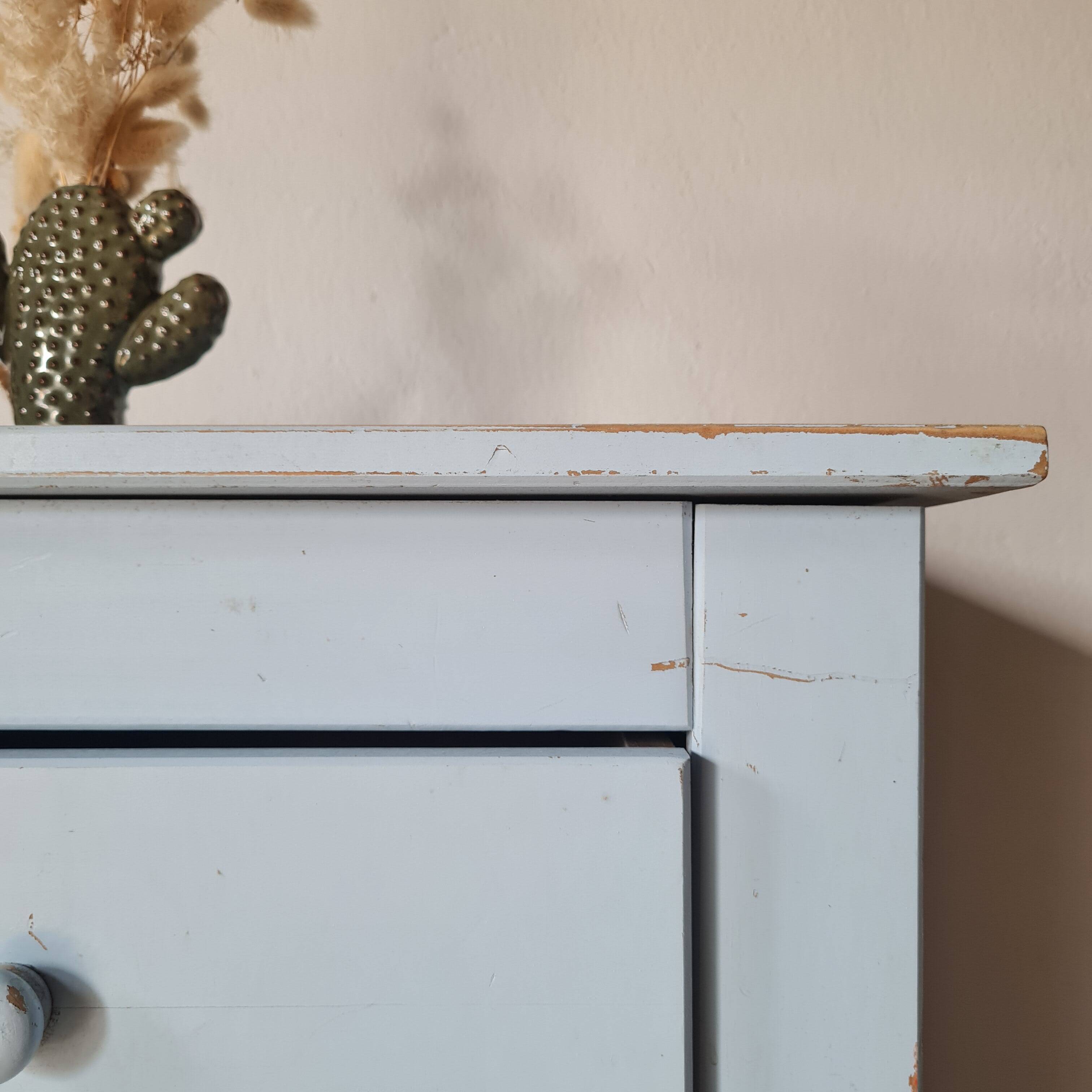 Handcrafted blue chest of drawers.