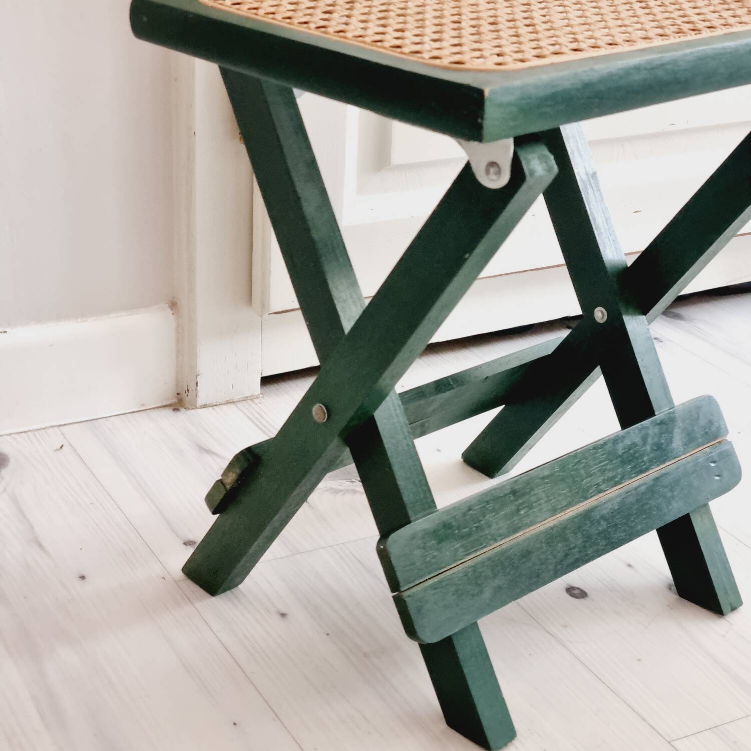 Small folding stool in green wood and cane