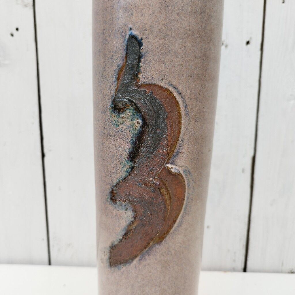 Enamelled ceramic roller vase signed