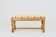 Vintage oak bench with striped linen fabric in a country style.