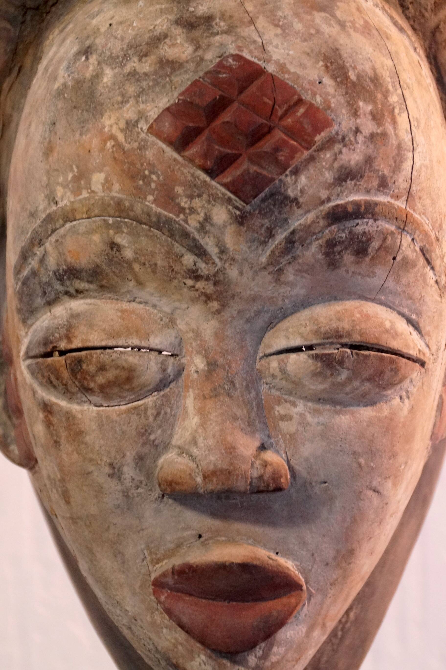 Punu mask on a base
