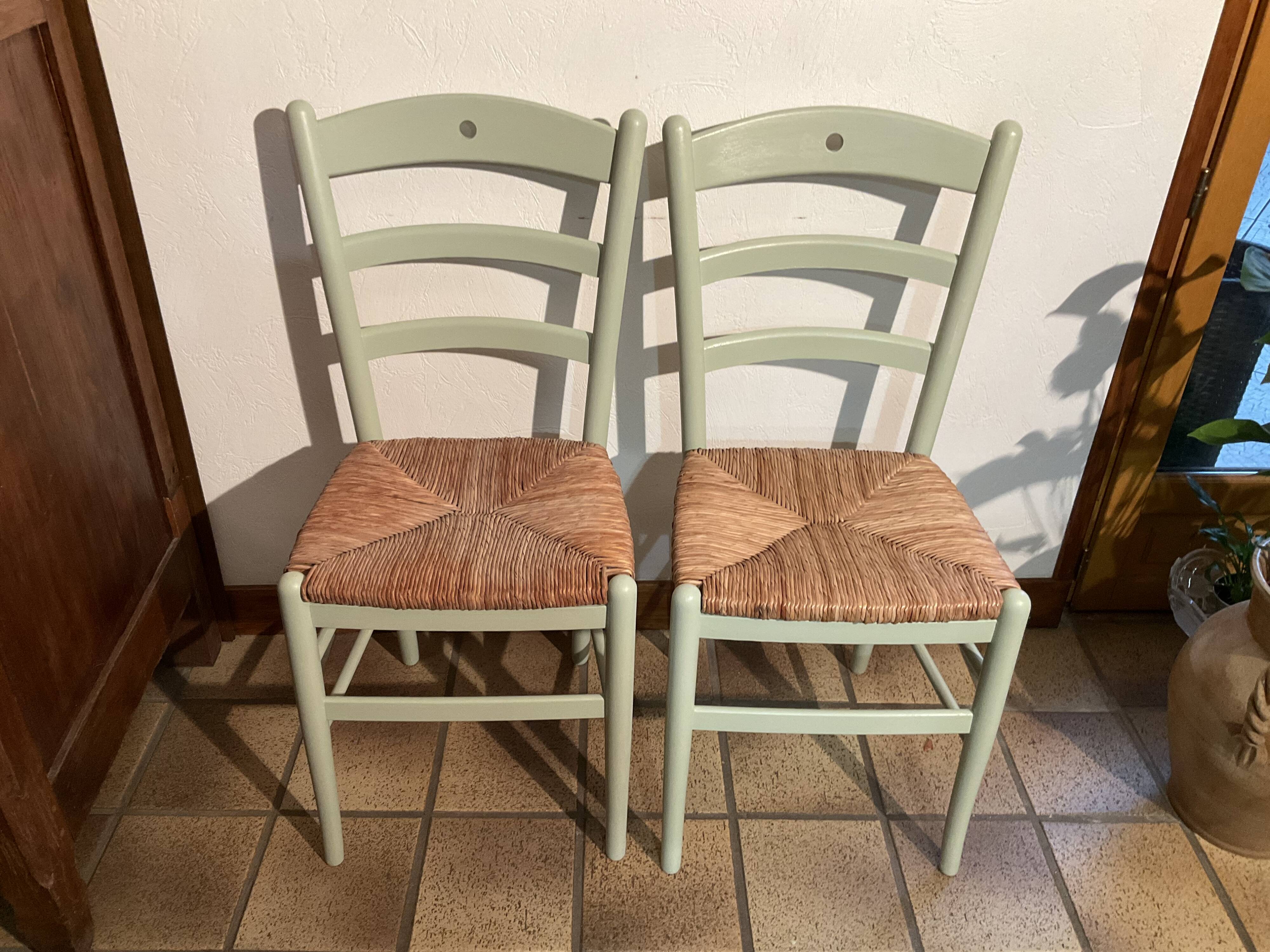 Pair of green straw sitting chairs