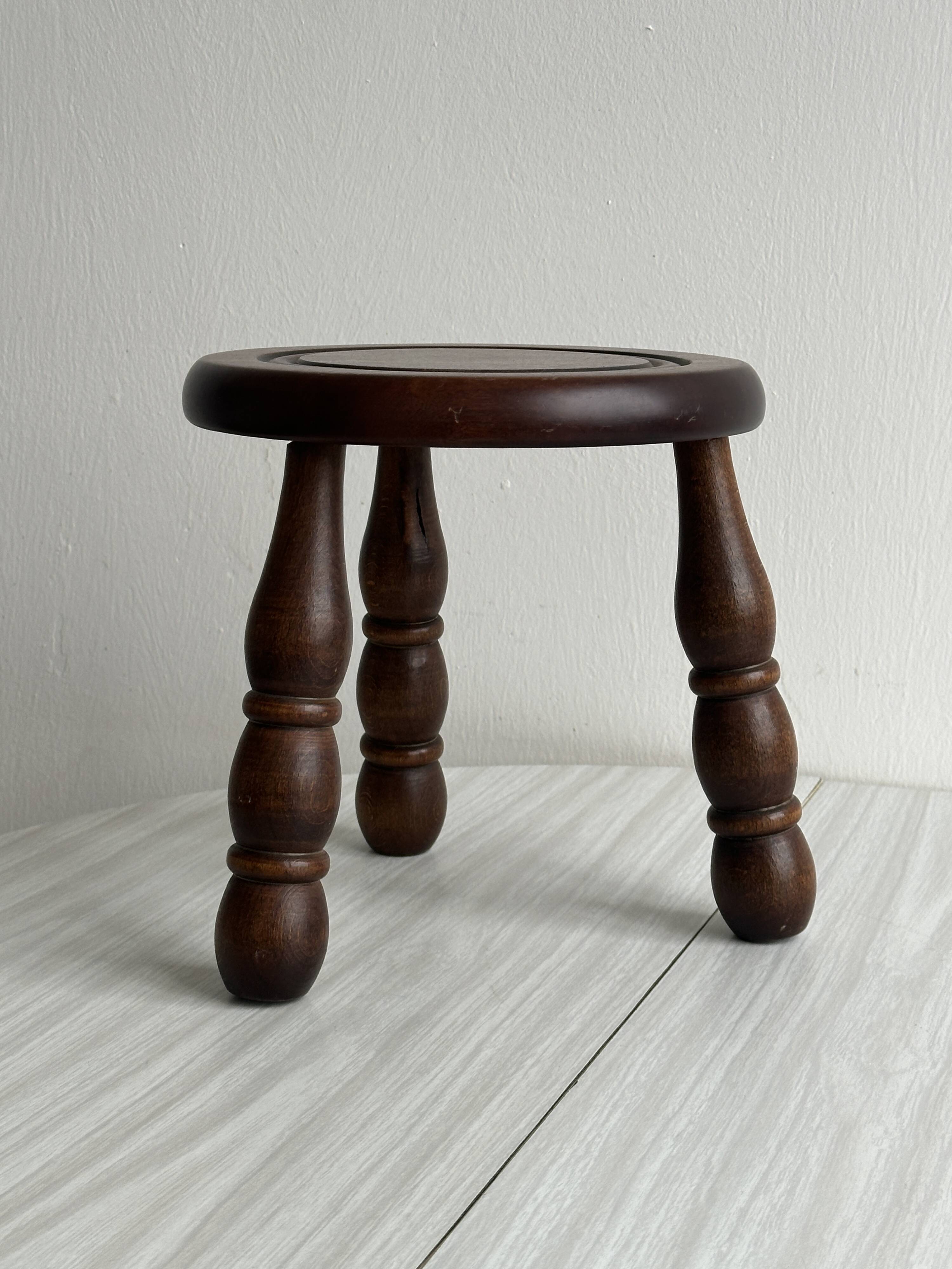 Small antique wooden tripod stool.