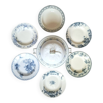 Antique deep plates in ironstone with a soup tureen.