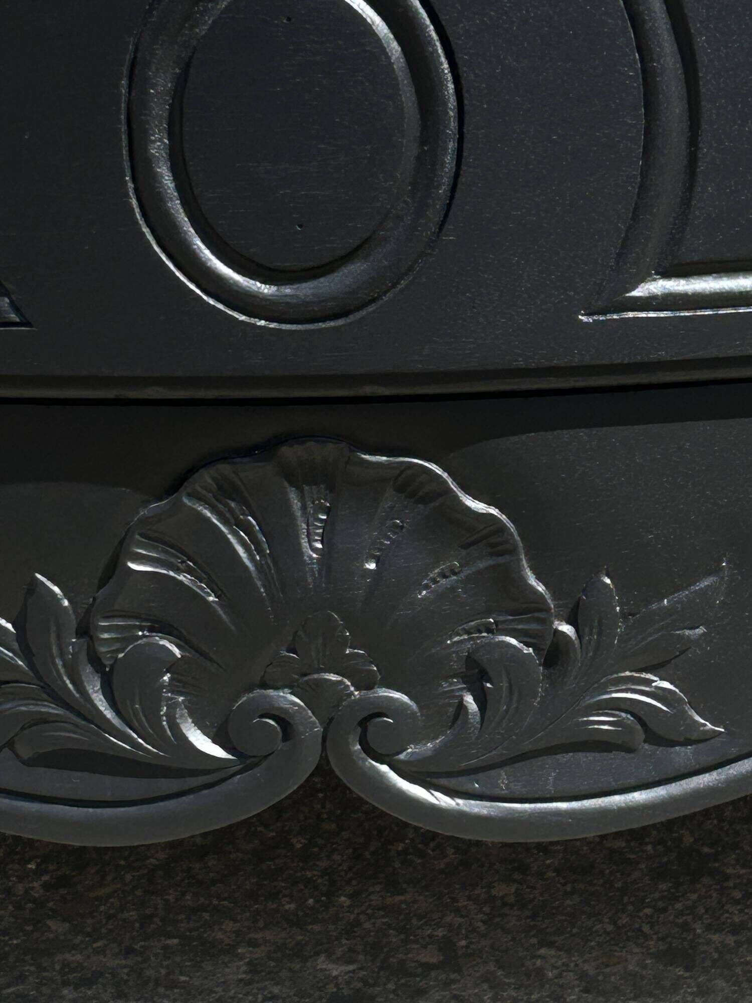 Louis XV style black lacquered chest of drawers with four drawers.