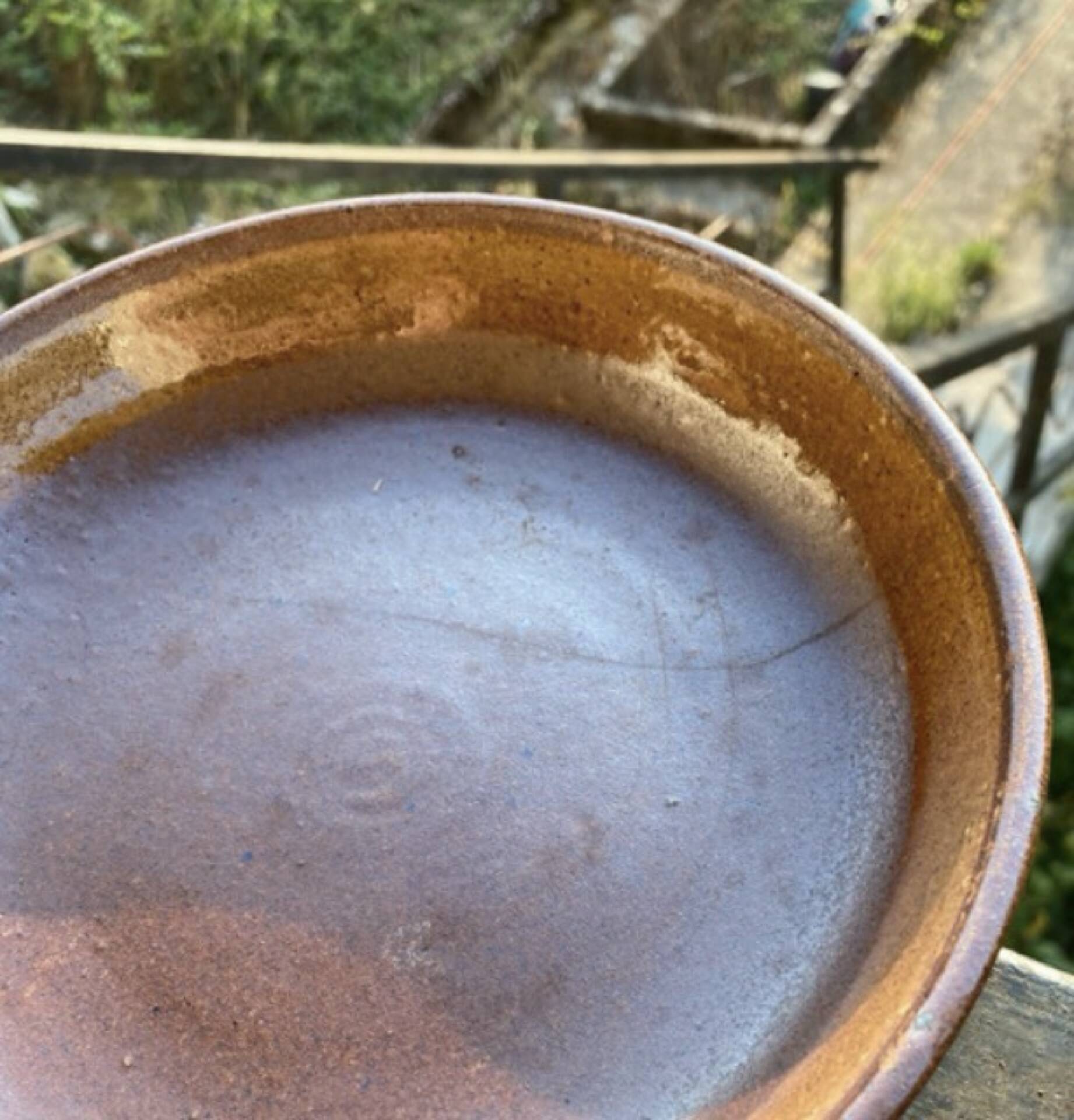 Deep plates made of organic, wild, earthy marsh clay.