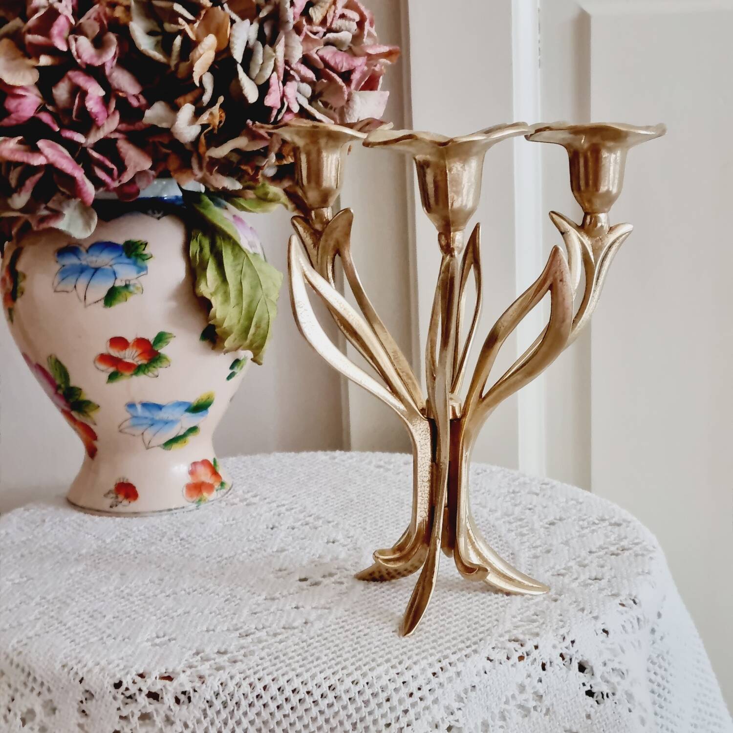 Tall brass flower candlestick