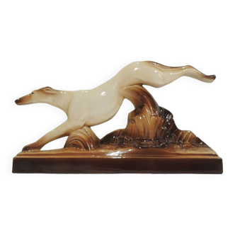 Beige and brown ceramic representing a “Greyhound/vintage 1930