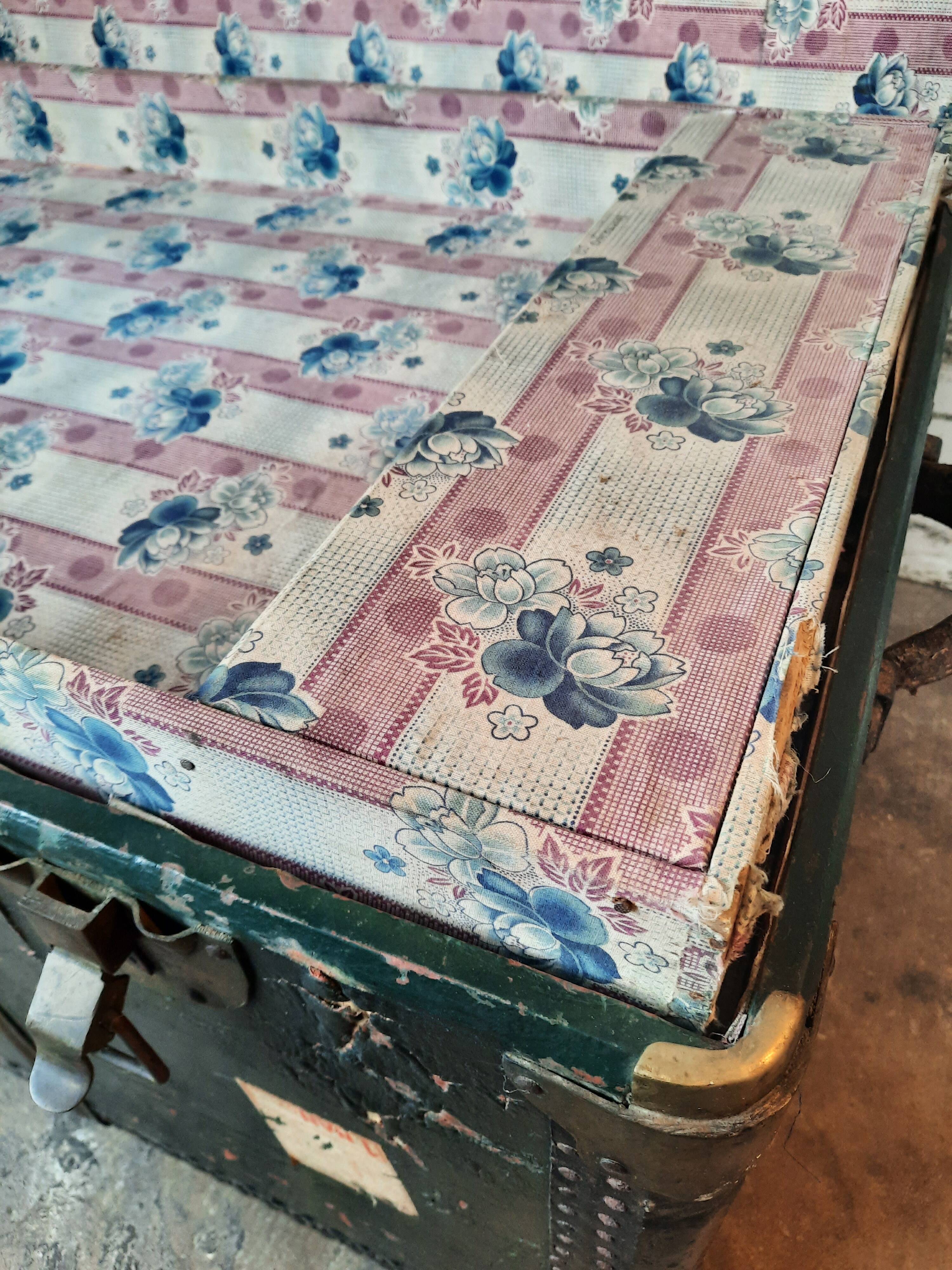 Old and large travel trunk, brass-plated corners