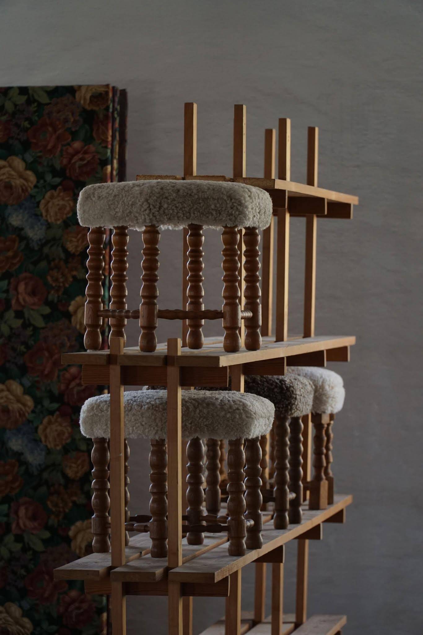 A hexagonal oak stool, seat refurbished in lambswool, Danish design from the 1950s.