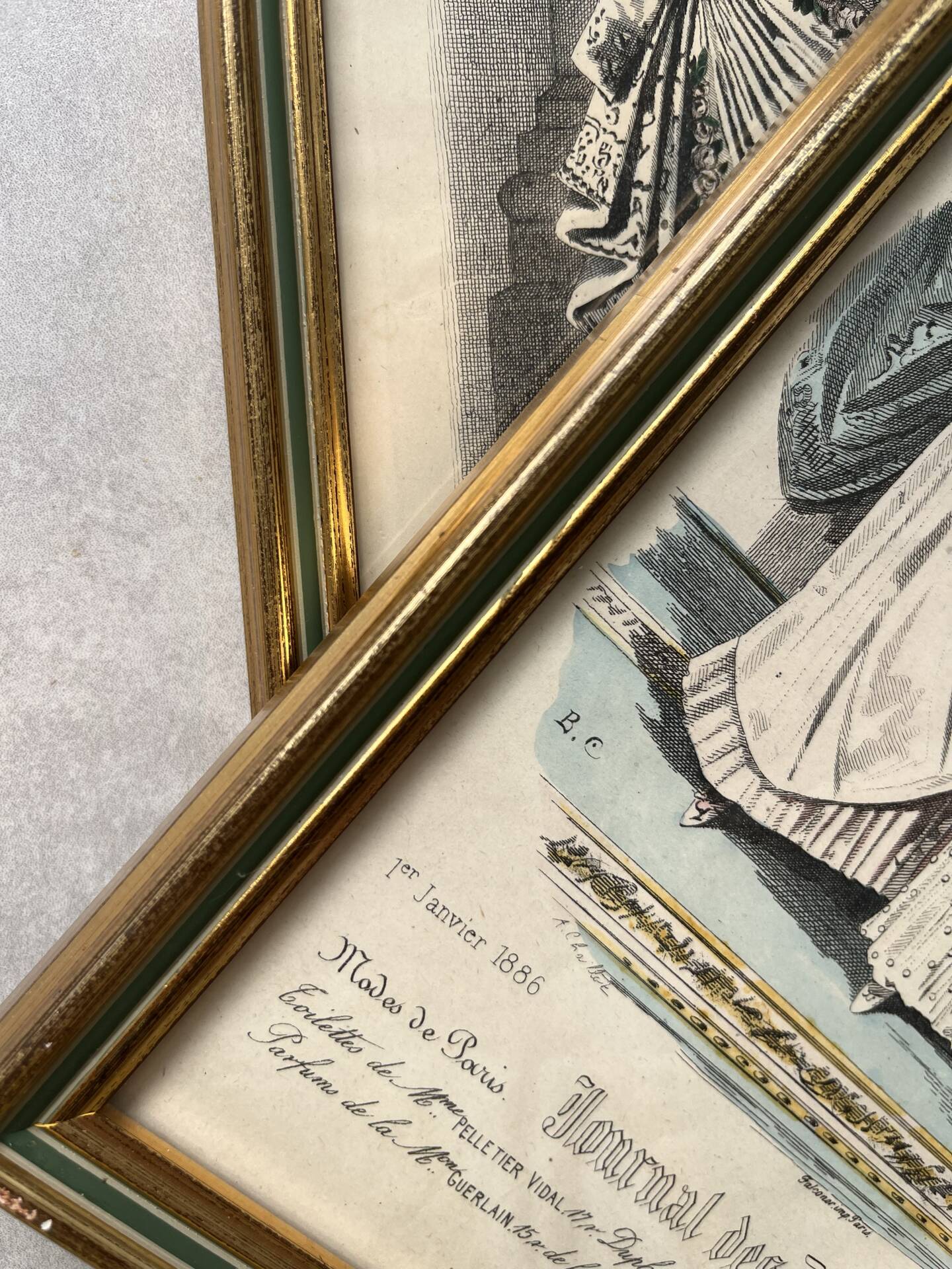 Pair of framed fashion engravings from the 19th century.