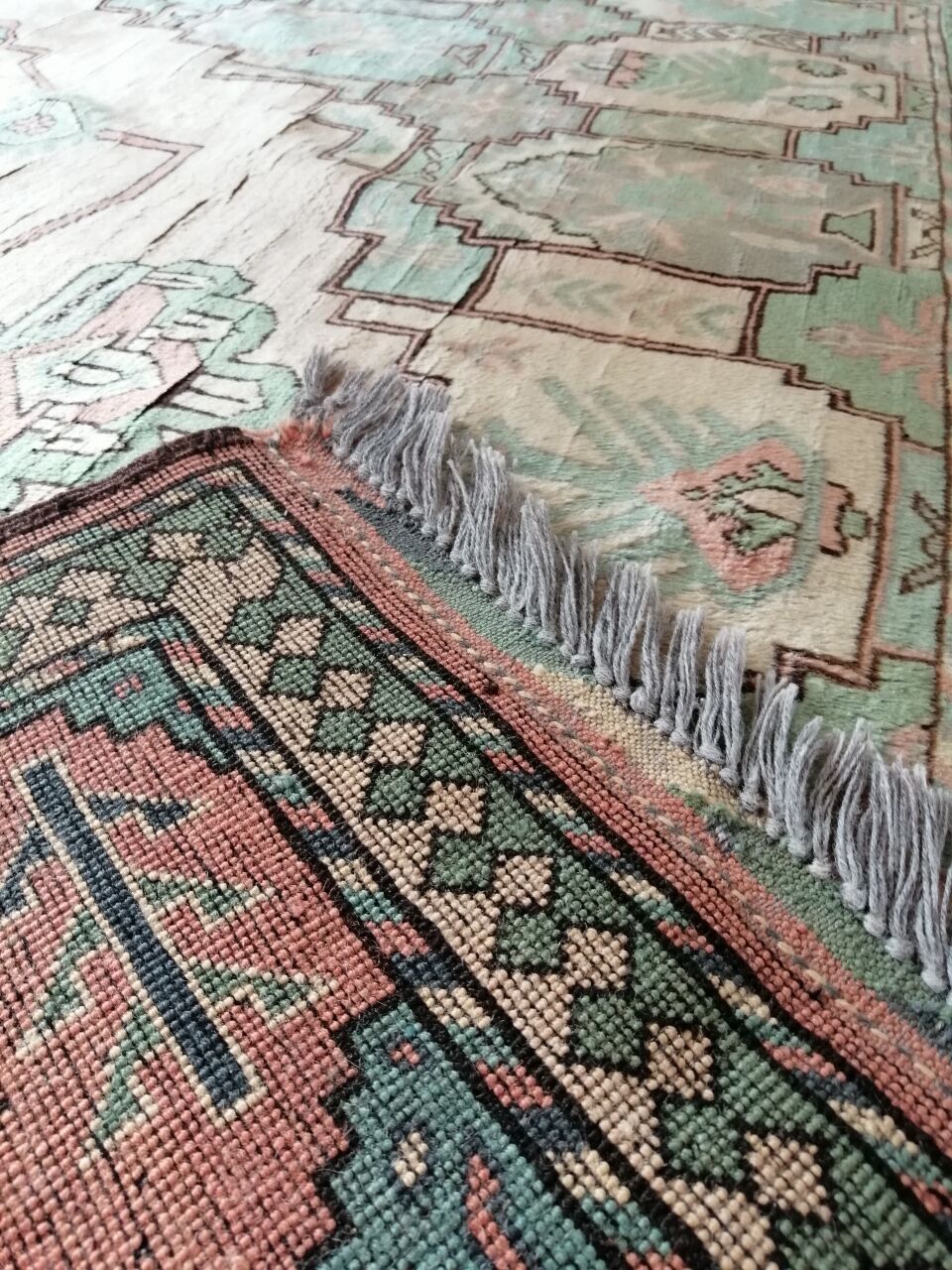 Afghan rug in pastel colors