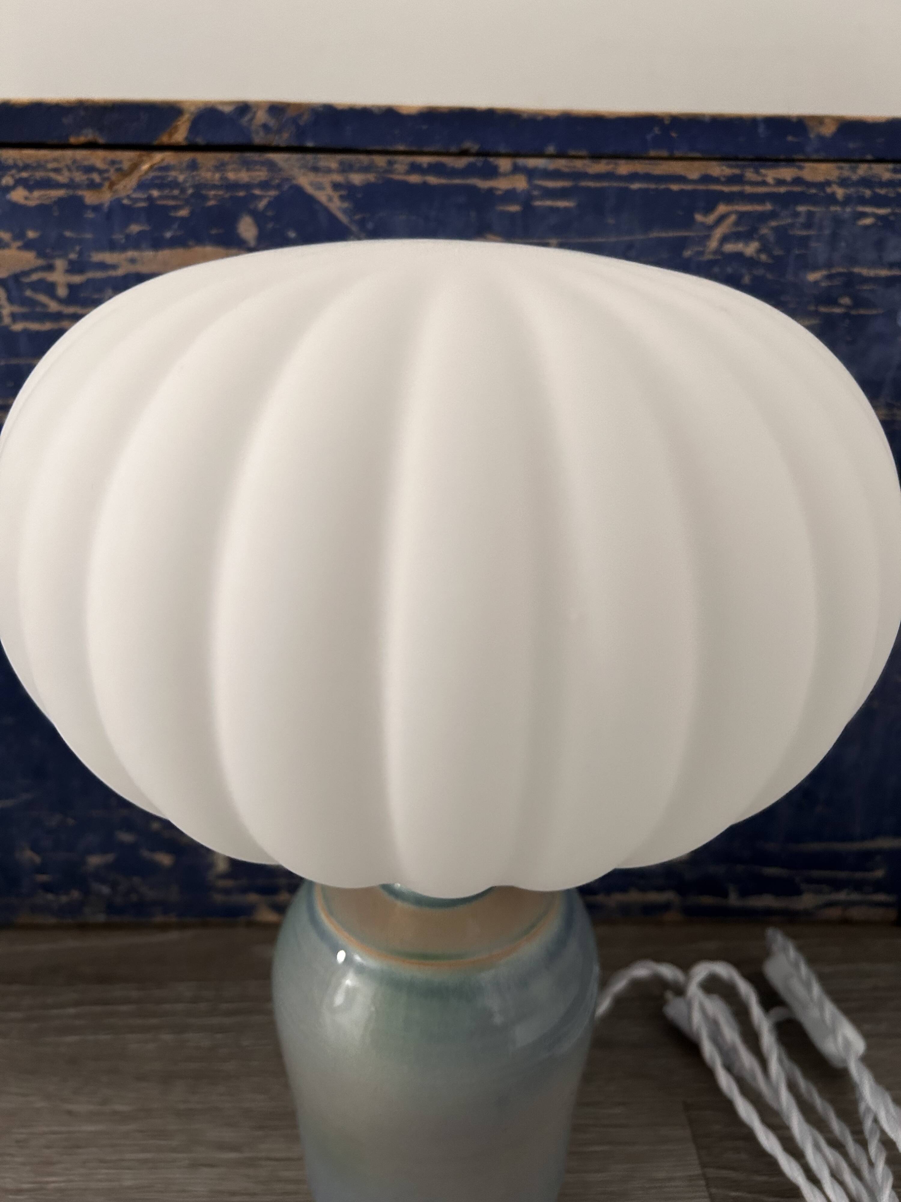 Table lamp in pastel blue and pleated opaline ceramic