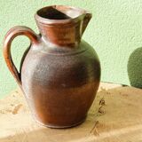 Large stoneware jug with a family name pattern, 1912