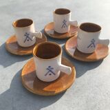4 ceramic cups and saucers