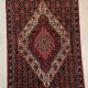 Tapis persan ancien laine tons rouge noué main